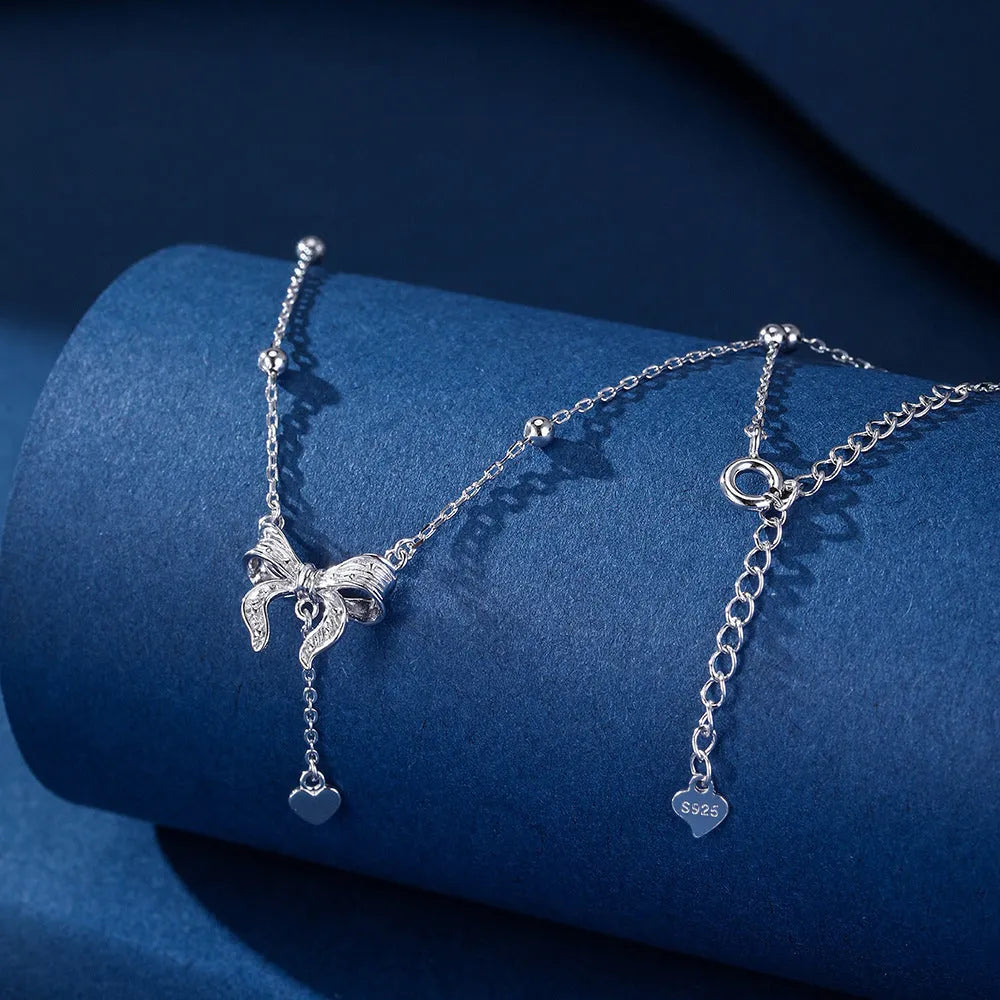 S925 pure silver butterfly and heart-shaped pendant on a silver O-ring clavicle chain.