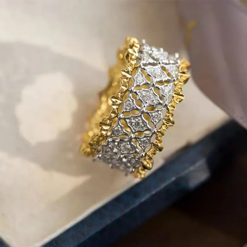 Geometric copper ring with gold electroplate and round zircon stone in two-tone finish