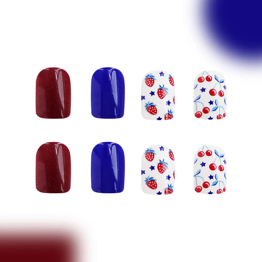 24 short glossy false nail stickers with strawberry and cherry patterns in red and blue colours