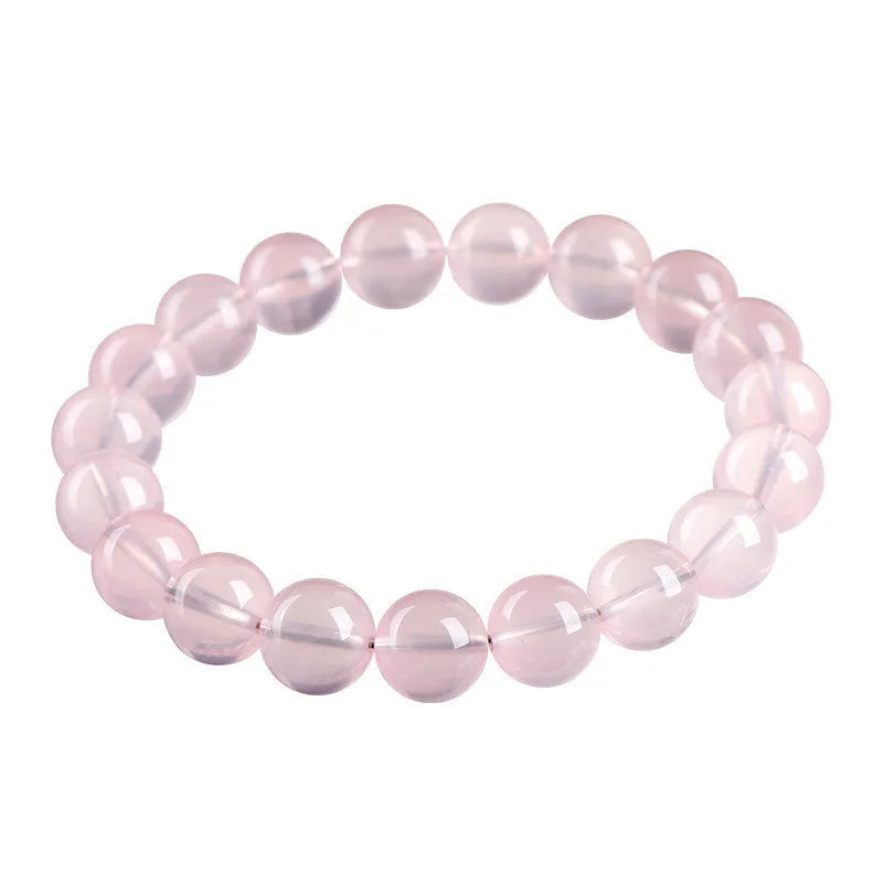 Women's natural starlight crystal bracelet with round pink beads in selectable sizes from 6mm to 22mm.