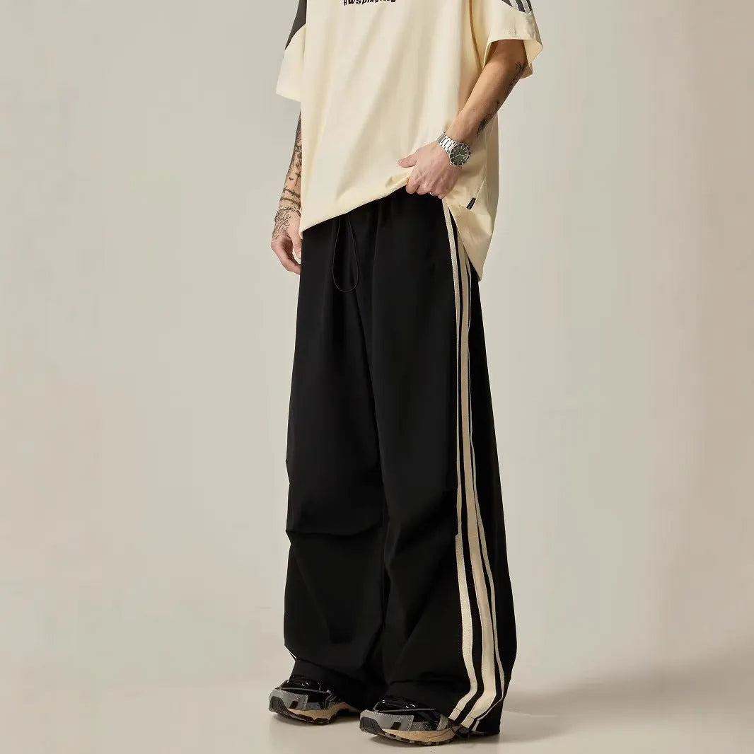 Men's black wide-leg climbing trousers with high waist and straight leg design