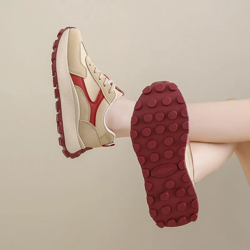 Women's solid colour low-top platform sports shoes with lace-up front and rubber sole.