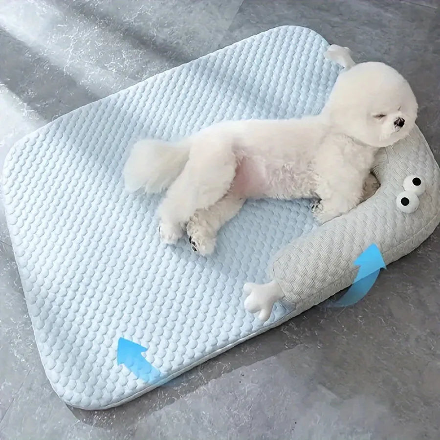 Blue and yellow pet bed cushion with big-eyed monster design on a non-slip base for dogs and cats.