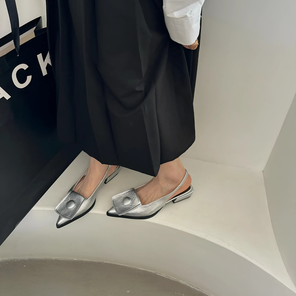 Women's low heel pointed toe sandals in apricot with a back strap and closed toe design.