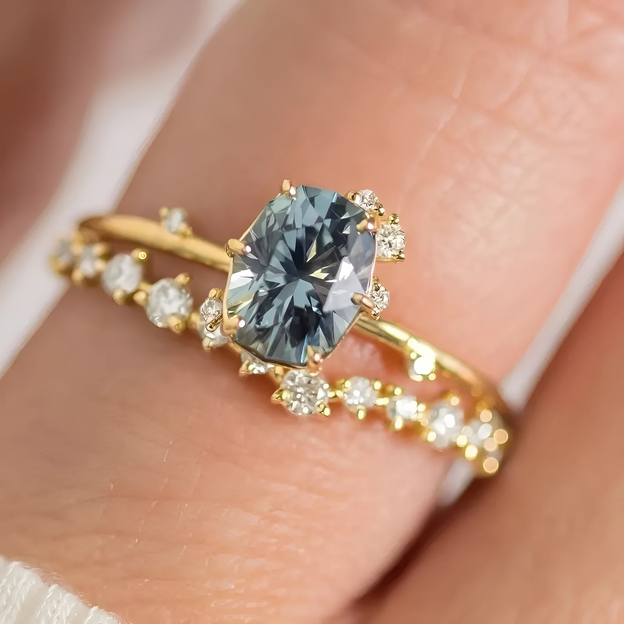 Gold plated flower-shaped ring with green zircon stone, shown in women's size.