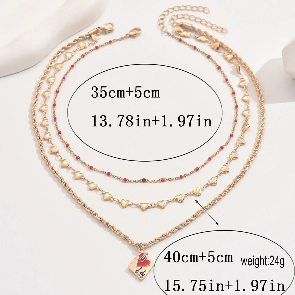 Gold-colour clavicle chain necklace with three-layer geometric heart pendant on adjustable chain