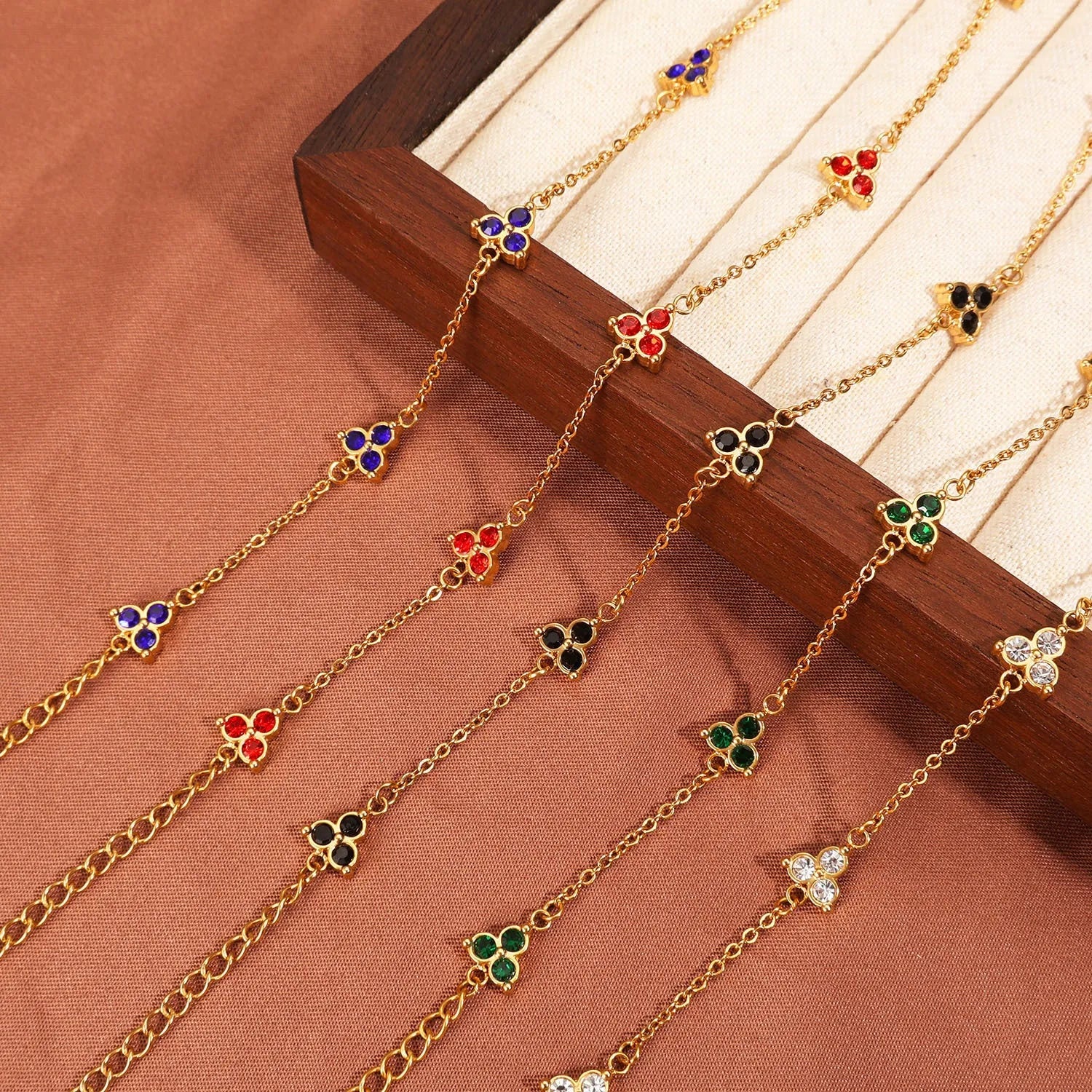 Women's stainless steel geometric triangle bracelet with three diamond stones and adjustable chain