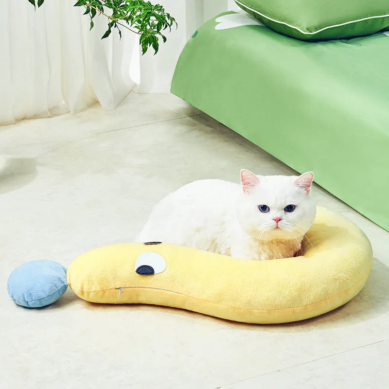 Blue rectangular pet cushion pillow for cats and dogs on a wooden floor.