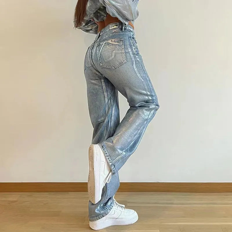Washed blue high waist straight leg women's jeans on a neutral background.