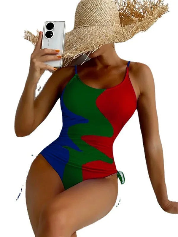 Women's sleeveless backless one-piece swimsuit in blue, purple, brown, or green with solid or striped pattern