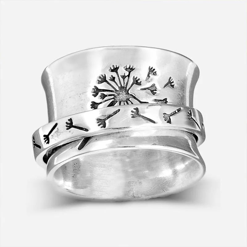 Silver rotatable flower ring showing floral detail and adjustable positioning