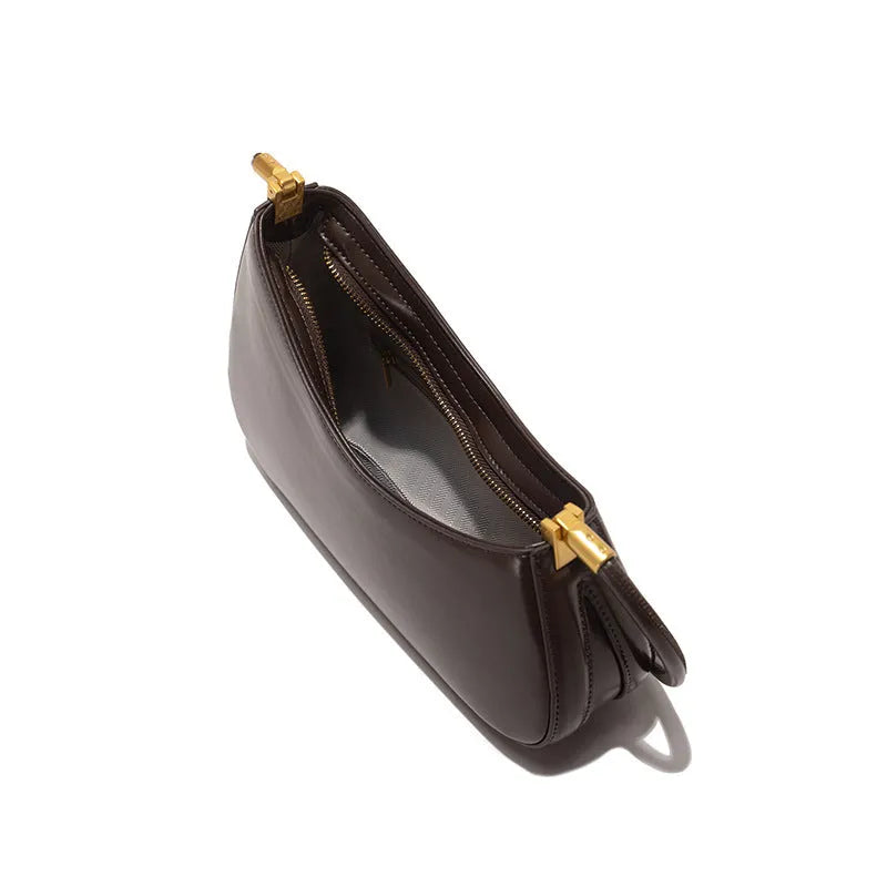 Retro oval women's underarm shoulder bag in PU leather with single strap and zippered interior