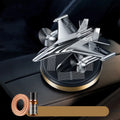 Silver solar powered rotating fighter aircraft perfume ornament with aluminium alloy seat.