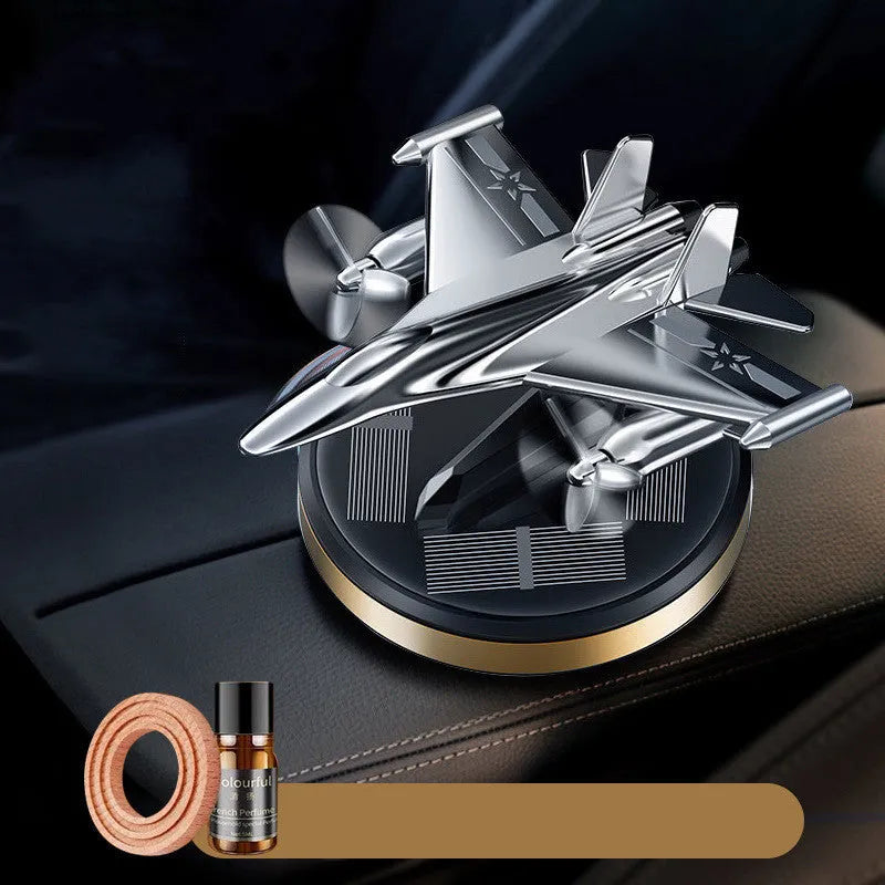 Silver solar powered rotating fighter aircraft perfume ornament with aluminium alloy seat.