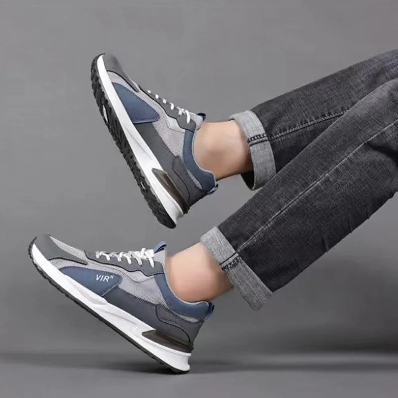Men's colour block mesh sneakers in grey with lace-up front and low-top design.