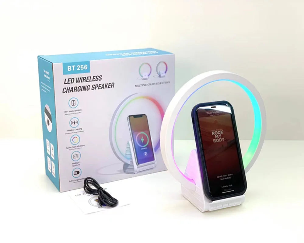 White rectangular smart Bluetooth speaker with wireless charging pad and ambient lighting