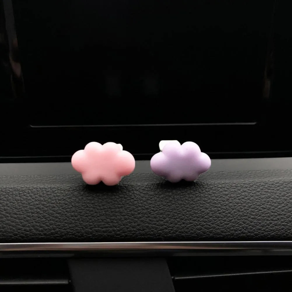 Resin cartoon Baiyun design car air vent fragrance clip in light green colour.