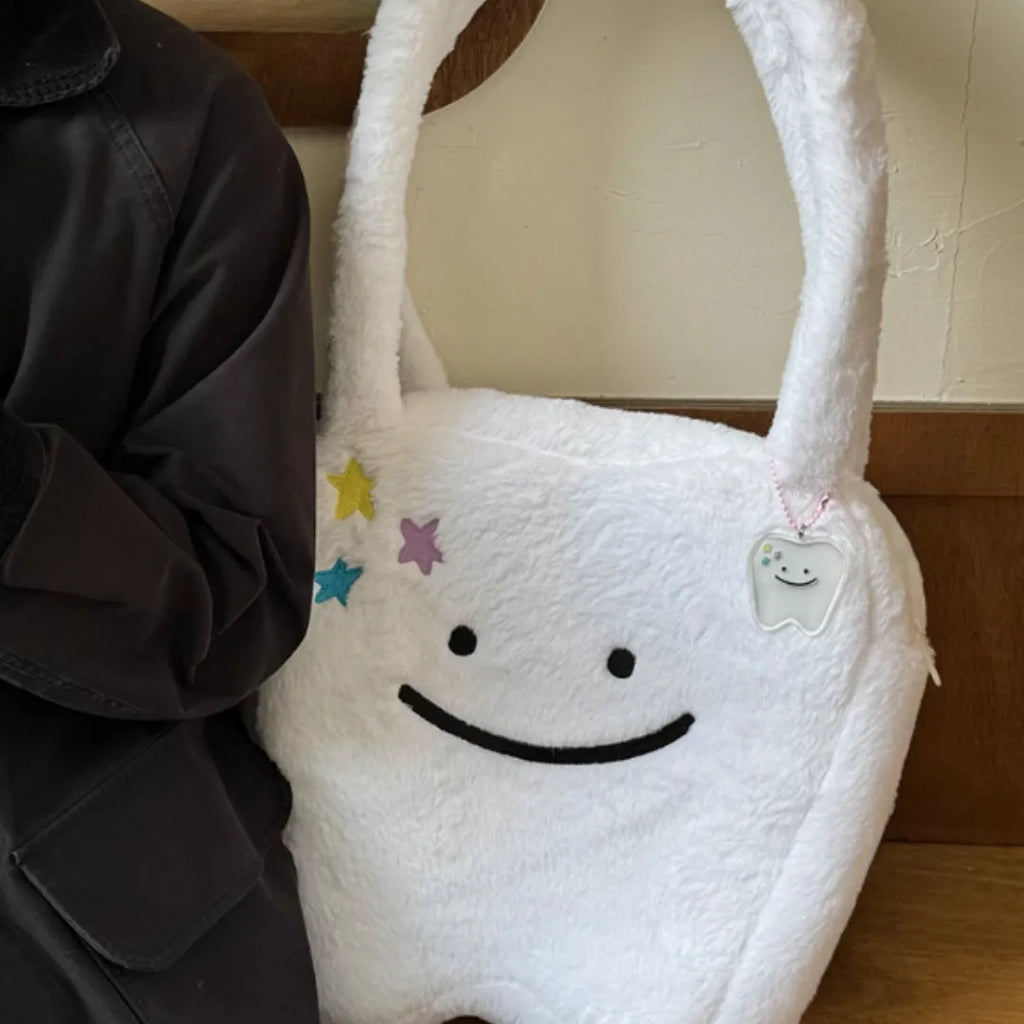 White plush shoulder tote bag with cute teeth design and zipper closure