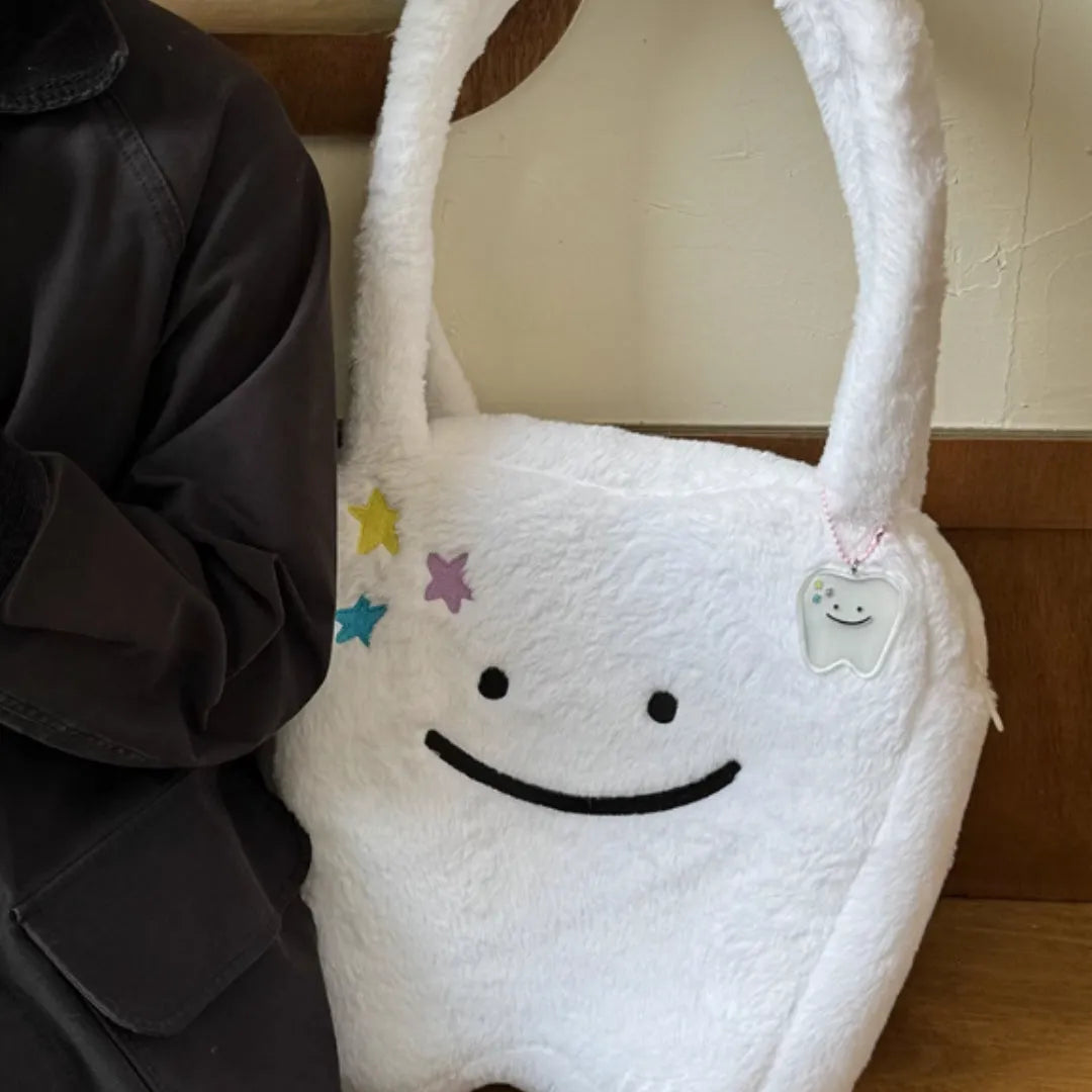 White plush shoulder tote bag with cute teeth design and zipper closure