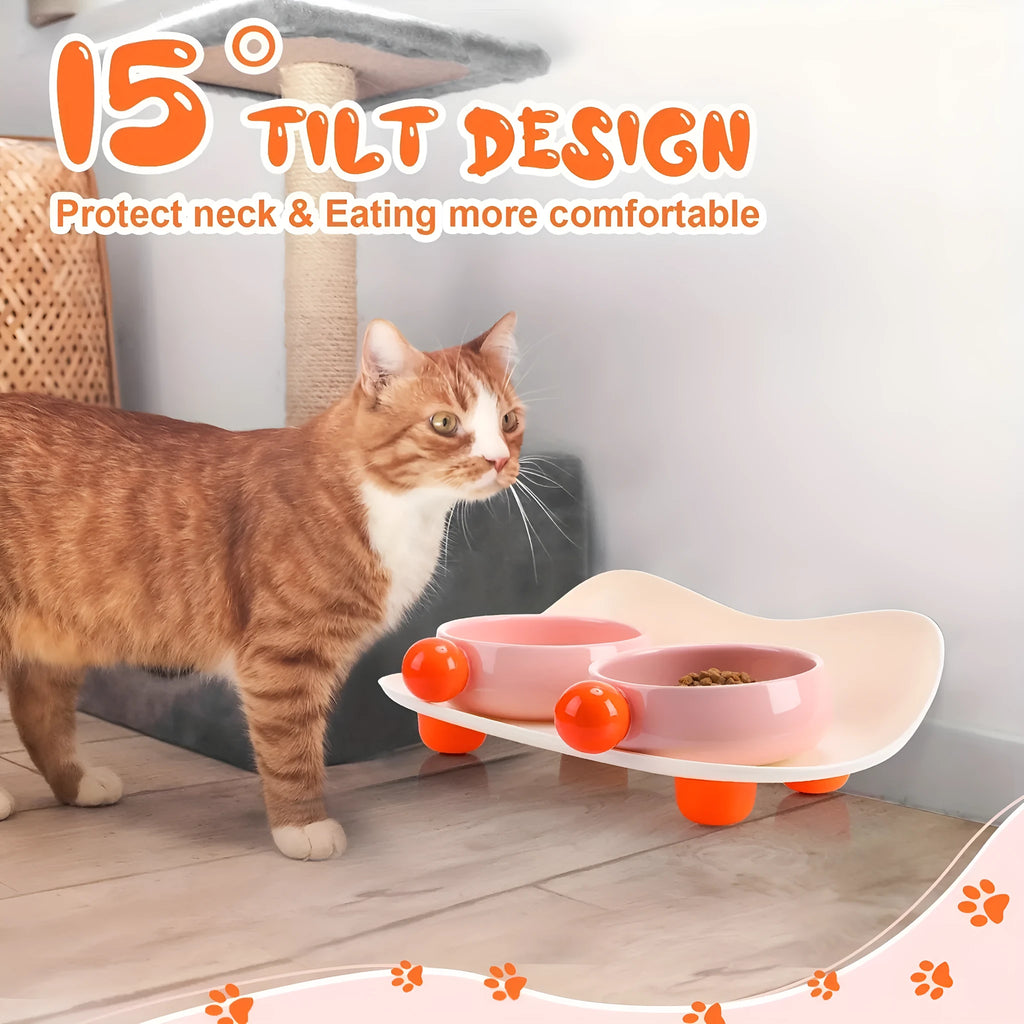 Elevated ceramic pet feeder with two bowls and non-slip base in pink, for cats and small dogs.