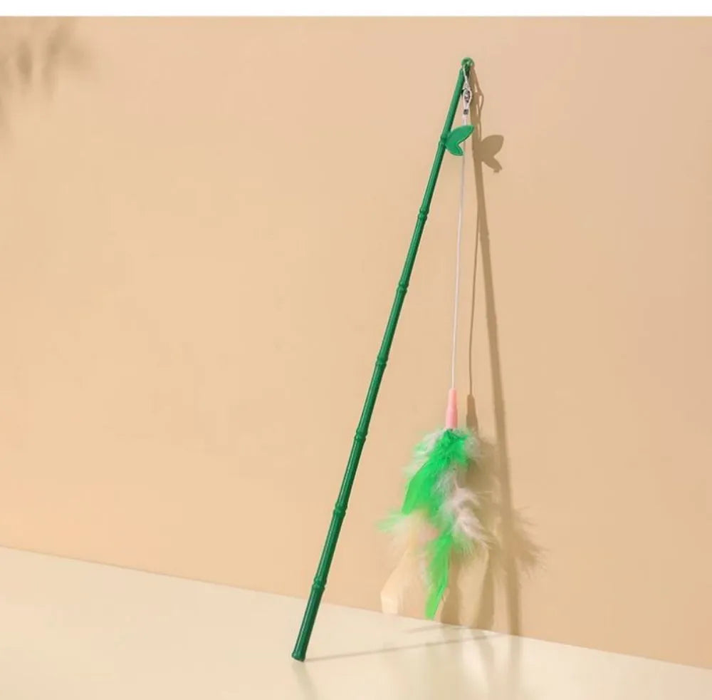 Green interactive cat wand toy with feather and bell refills for feline play