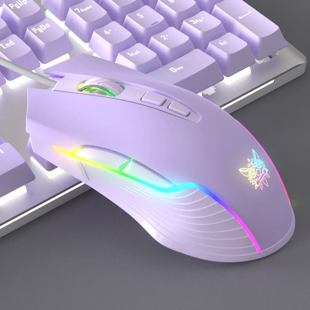 Purple and white mechanical keyboard and mouse set with backlight illumination on desk