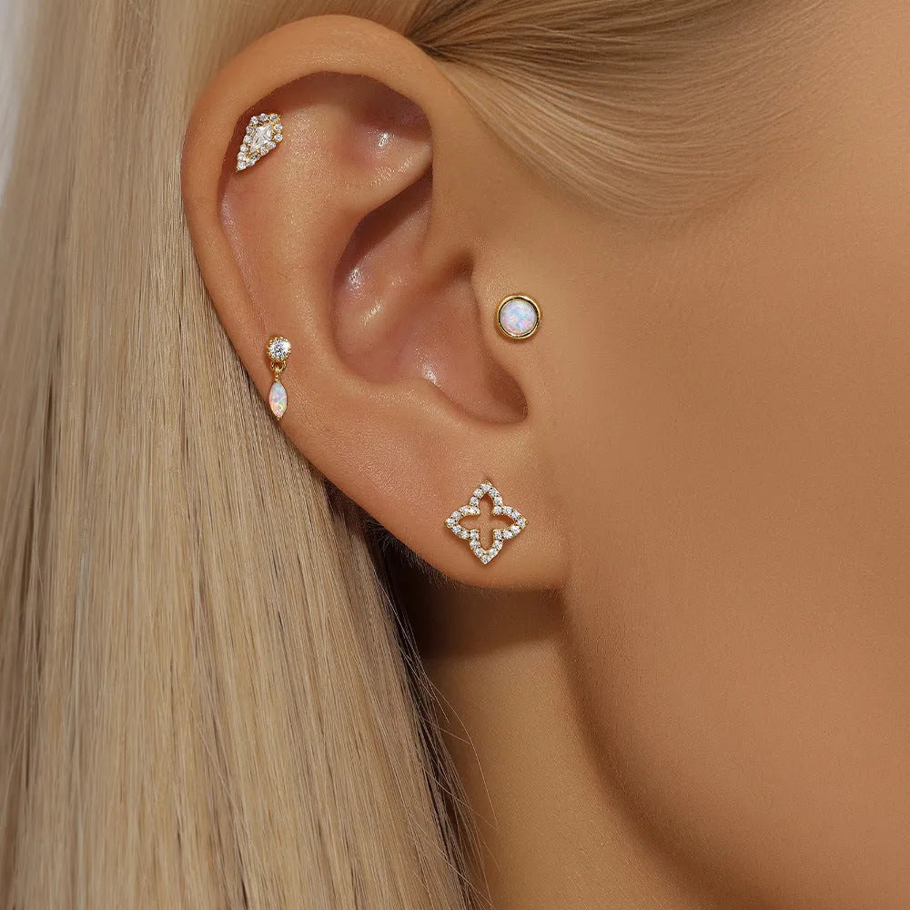 A pair of geometric S925 sterling silver ear bone studs with a flat column thread post, shown in a gold tone finish.