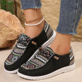 Women's black flat round toe low-top shoes with an oversleeve design on a white background.