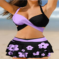 Women's purple bikini swimsuit with matching skirt showing lace-up detail and high waist briefs style