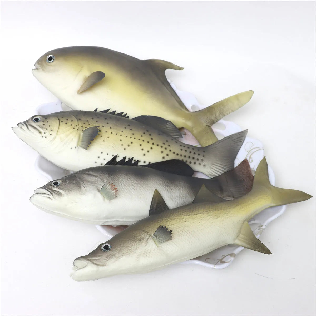 Set of three realistic PU simulated fish ornaments: yellow-fin tuna, small tuna, and yellow croaker.