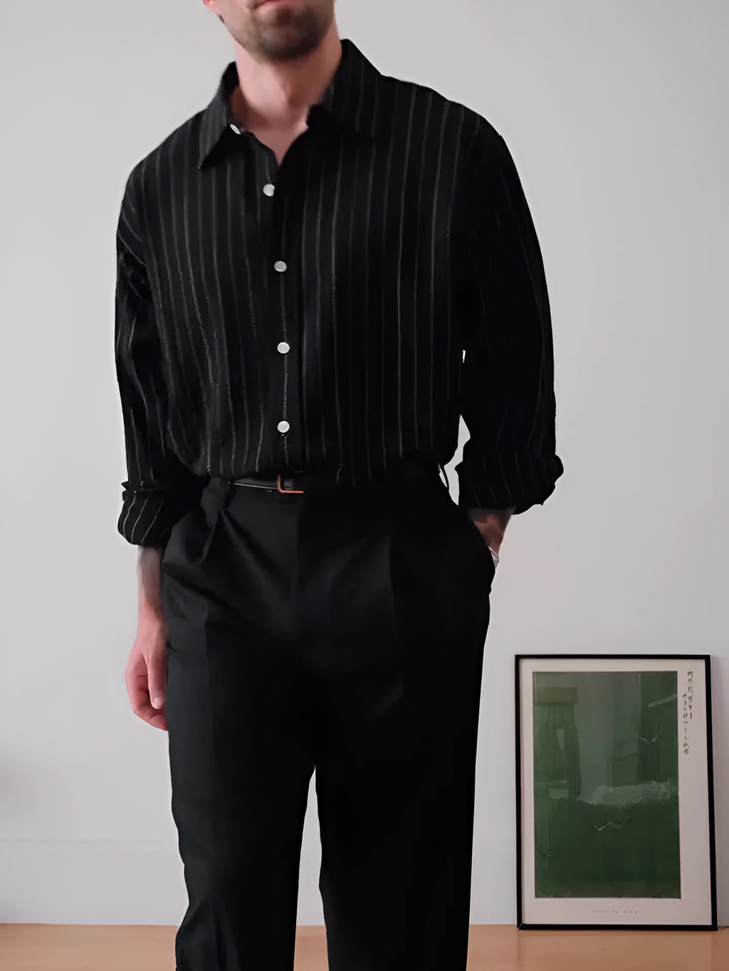 Men's black pinstriped button-down shirt with a regular fit collar on a hanger.