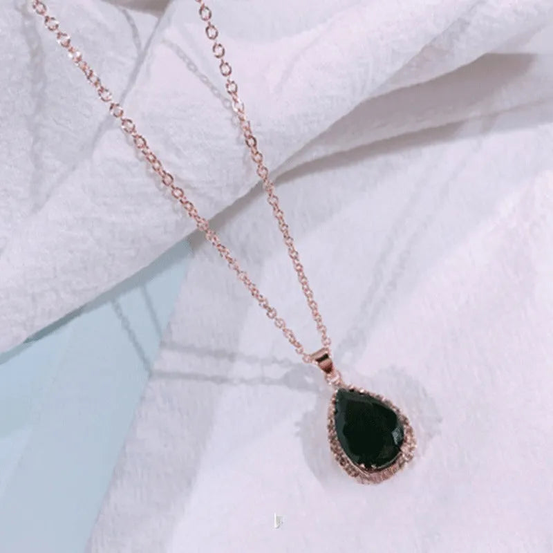 Rose gold water drop necklace with geometric rhinestone pattern in pink colour