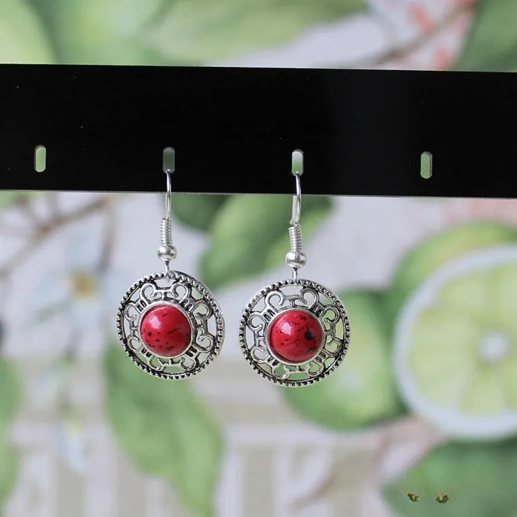 Handmade geometric Miao silver earrings with turquoise stones and ethnic patterns in three colour options