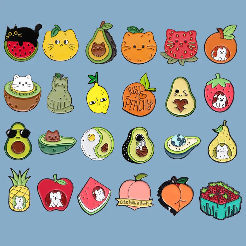 Colourful cartoon fruit and letter design metal brooch pin on a solid background.