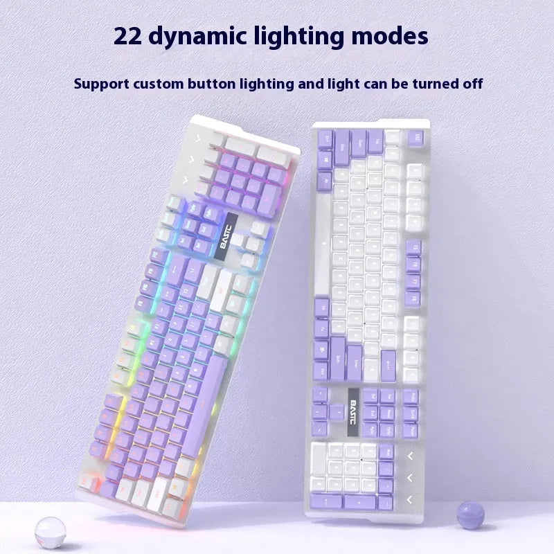 Purple and white mechanical keyboard and mouse set with backlight illumination on desk