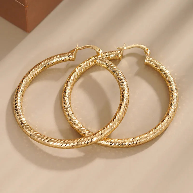 Geometric drop ear clips for women in copper with ring and line design elements