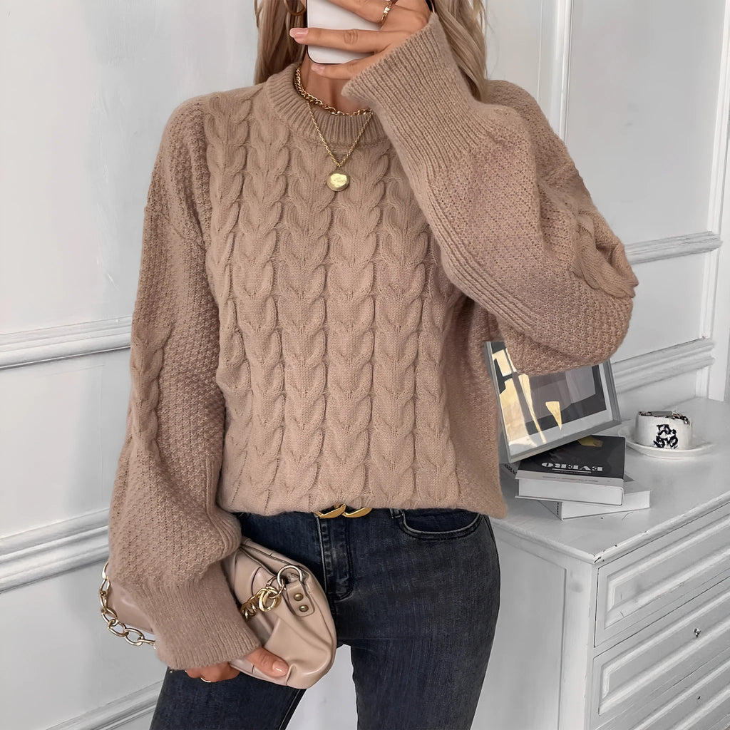 Women's beige casual sweater with twist detail and round neckline on hanger