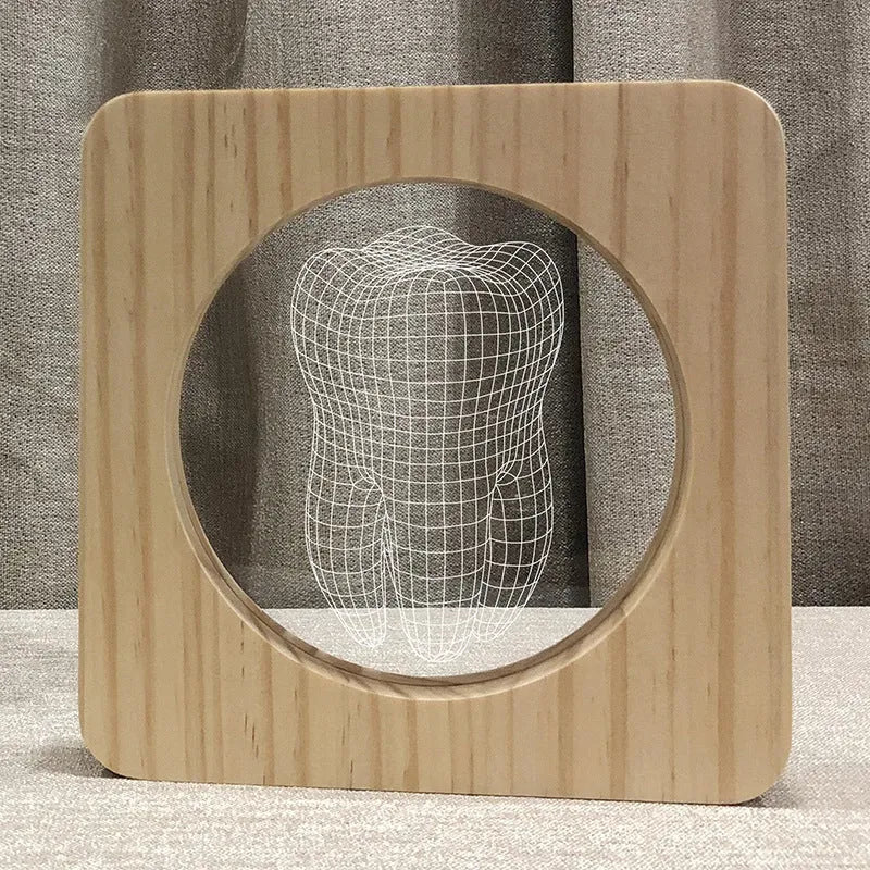 Tooth-shaped wooden colour acrylic USB night lamp on a table