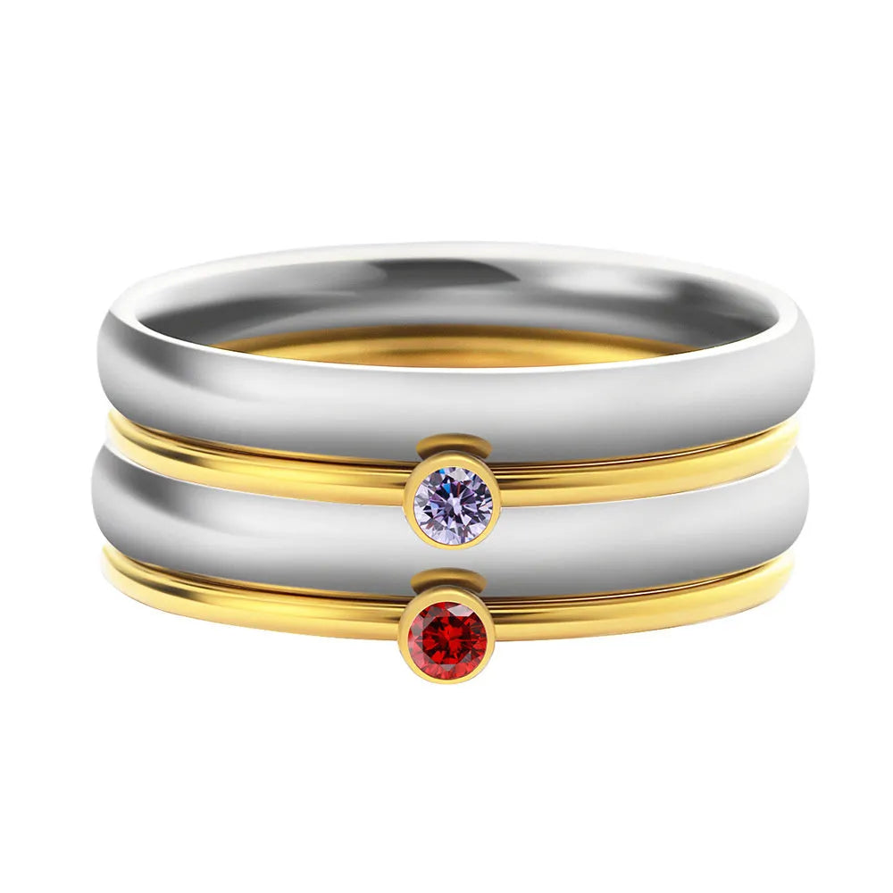 December birthstone engraved titanium steel ring with superimposed geometry design on a finger.