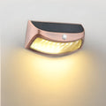 Solar-powered retro decorative wall lamp with smiling face design for garden lighting