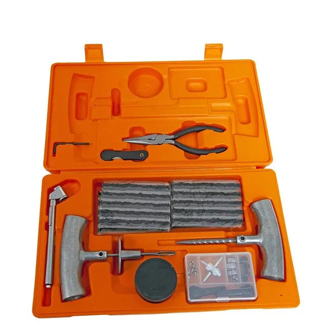 Emergency tyre repair tool set with pressure gauge, insertion tool, and reamer in a yellow case.