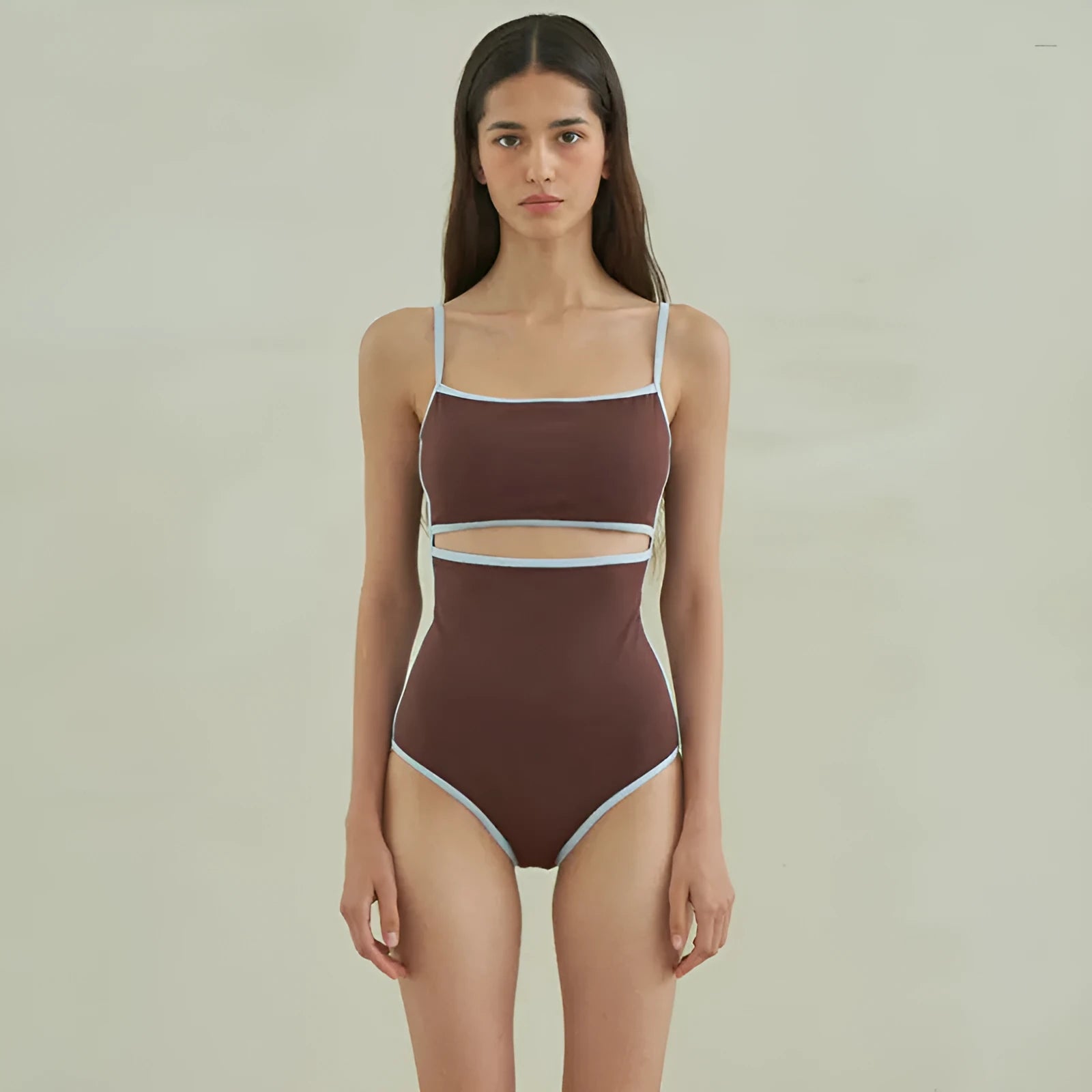 Brown women's one-piece swimsuit with triangle neckline design on mannequin