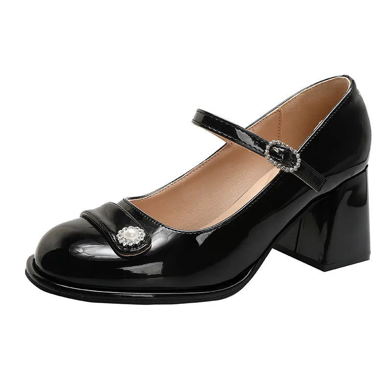 Black patent leather women's chunky heel shoes with round toe and buckle fastening for wide feet