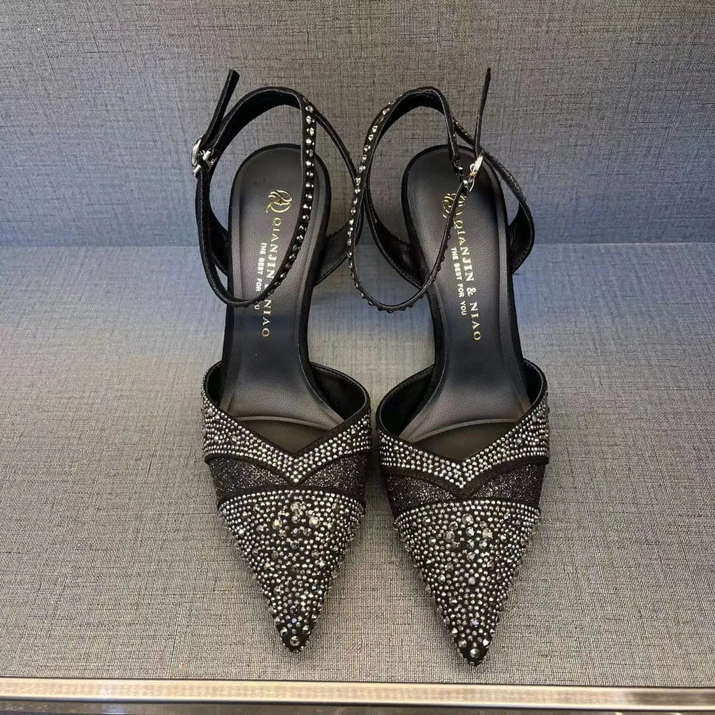Women's black hollow high heels with stiletto heel, pointed toe, and red sole