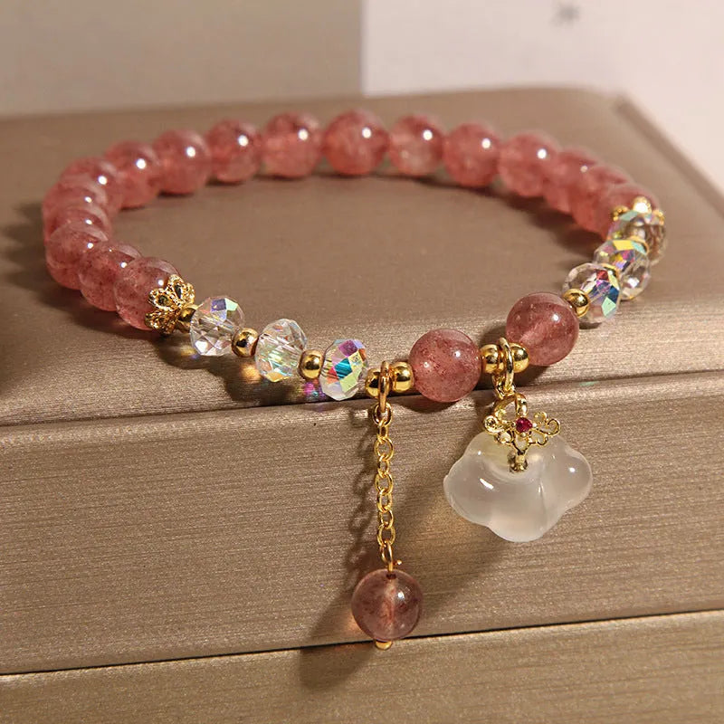 Women's crystal bracelet with strawberry quartz beads and white agate auspicious clouds design
