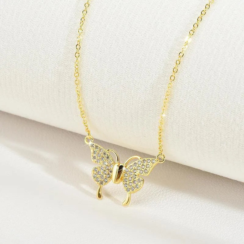Women's gold and silver titanium steel clavicle chain with magnetic butterfly pendant on twisted chain.