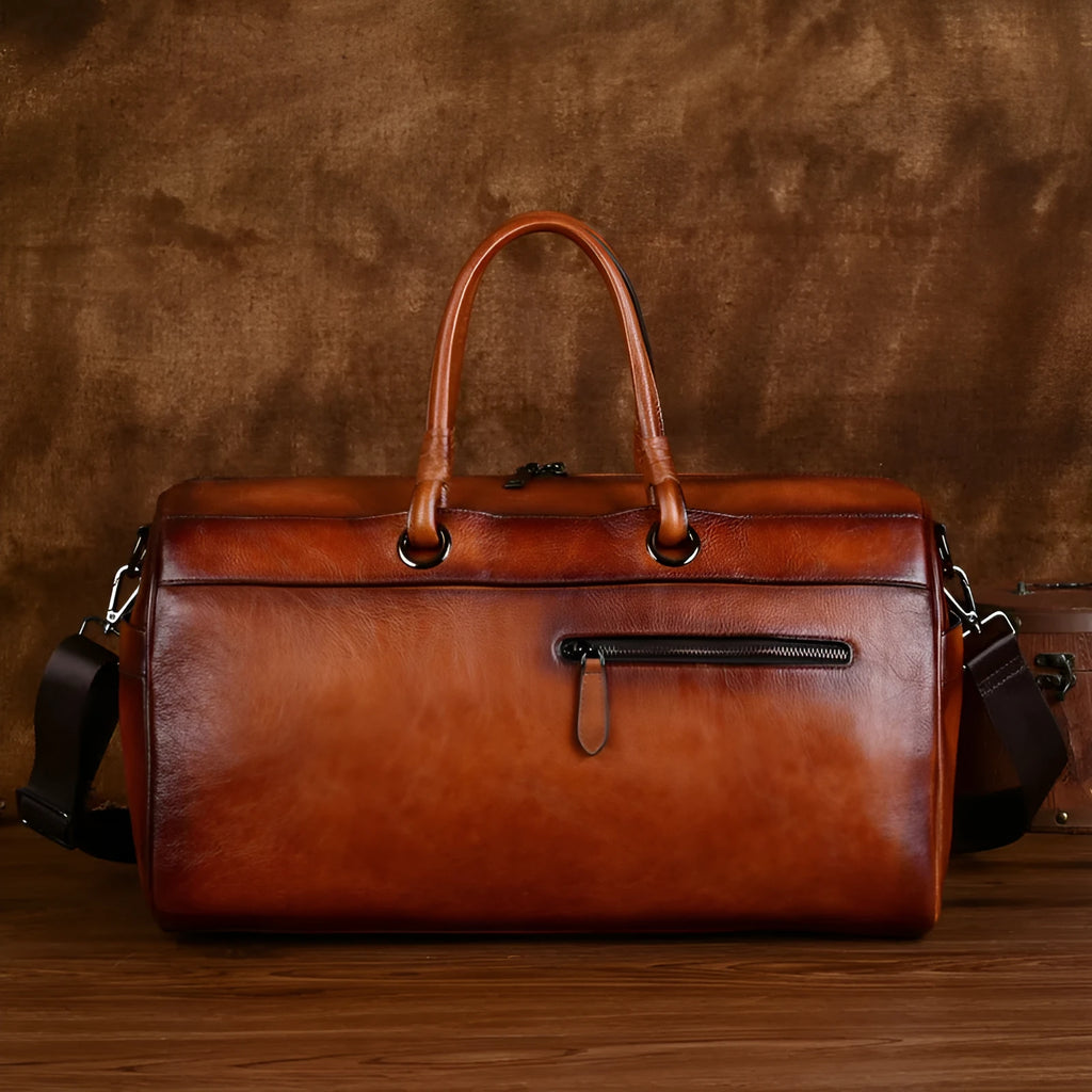 Handmade retro brown leather satchel with large capacity and an expandable design.