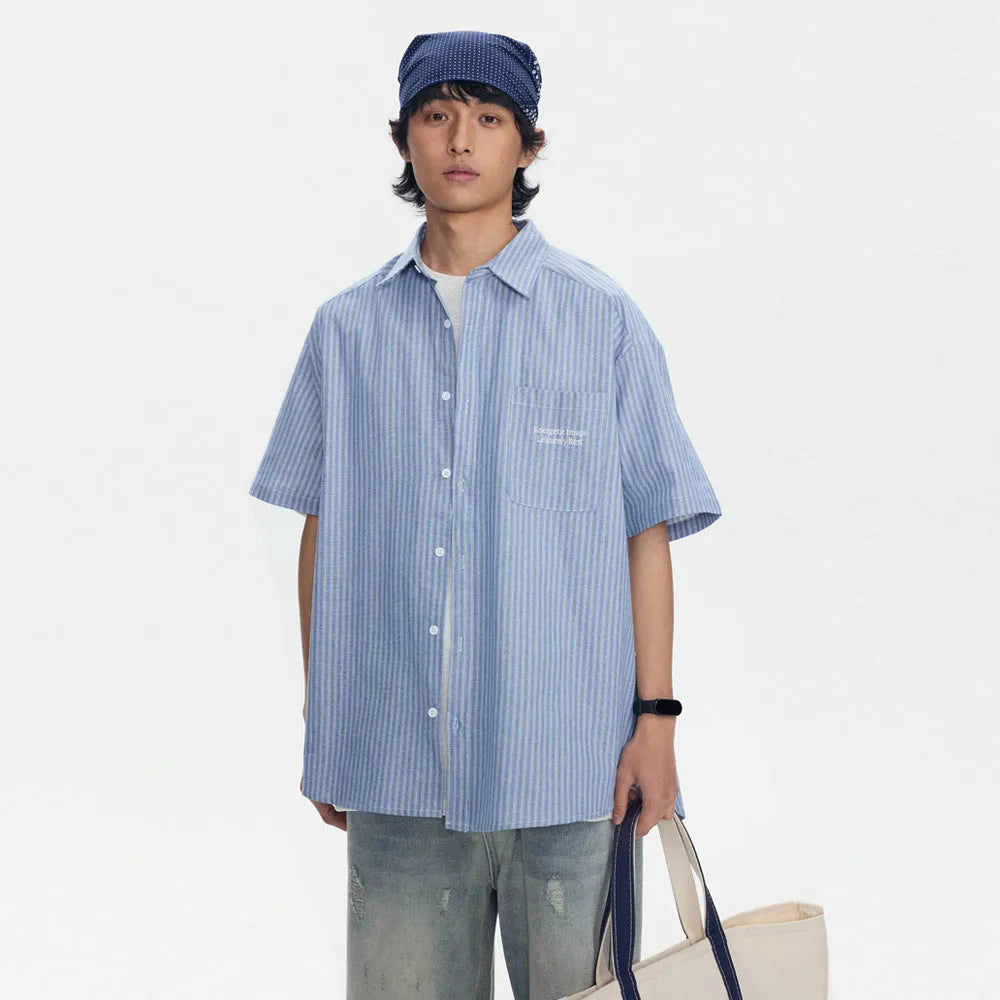 Blue striped loose short-sleeved shirt in cardigan style on a hanger