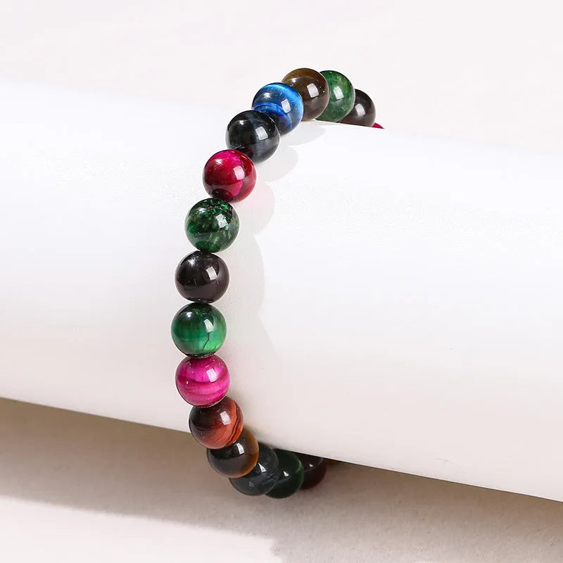 Colourful tiger-eye stone bracelet with geometric and round beads in multiple sizes
