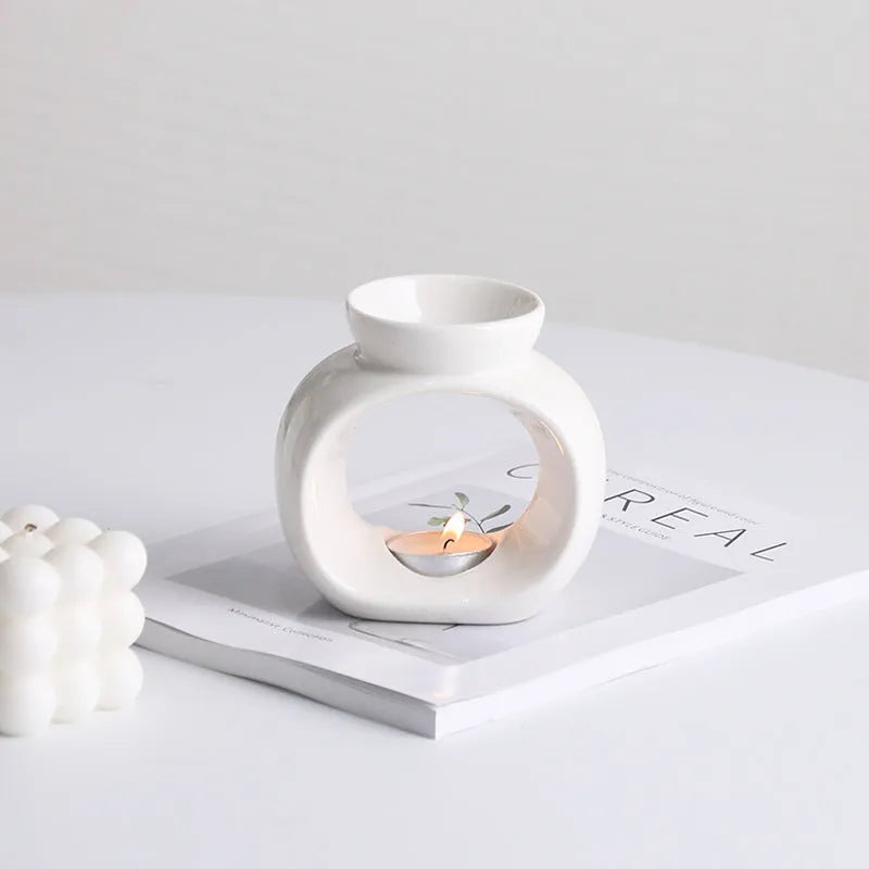 White Nordic style ceramic aromatherapy stove ornament on a tabletop
